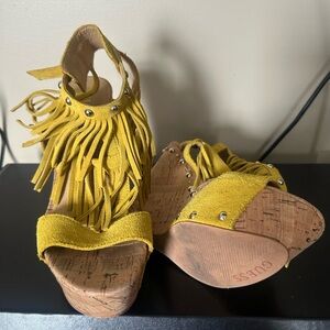Guess Mustard Fringe Wedge Sandals